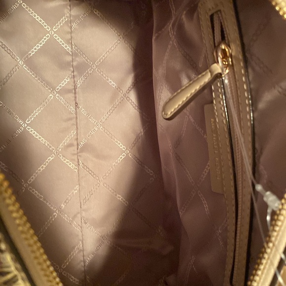 NWT Michael Kord Metallic Satchel
Gold
Never Used - Picture 9 of 9